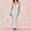 Vestido largo estilo corset con falda fluida y escote palabra de honor – elegante y estructurado